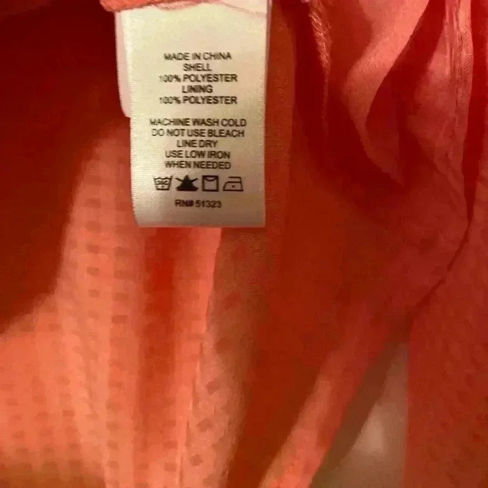 Cece beautiful peach blouse. This blouse has bell sleeves with tie closures. - Picture 3 of 7